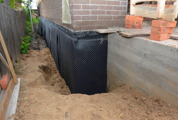 SJ Waterproofing Pros technician performing targeted Waterproofing assessment in Moscow, OH